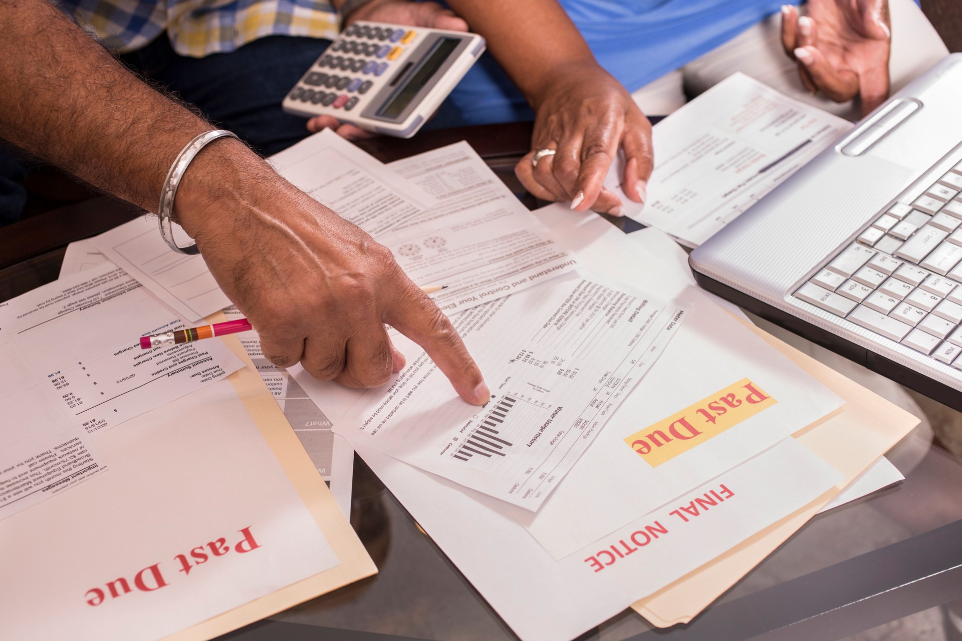 Senior couple paying monthly bills at home.