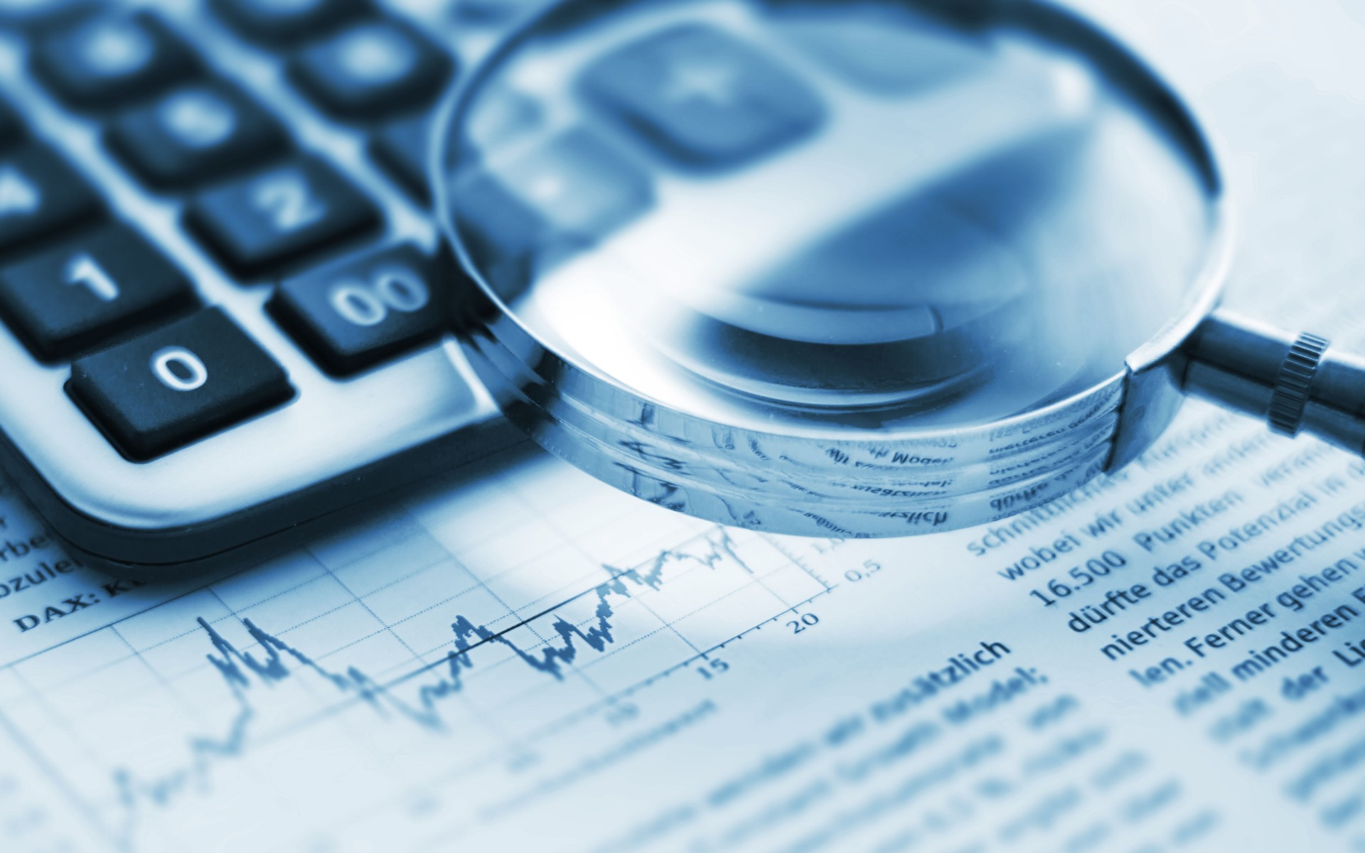 Magnifying glass on financial chart