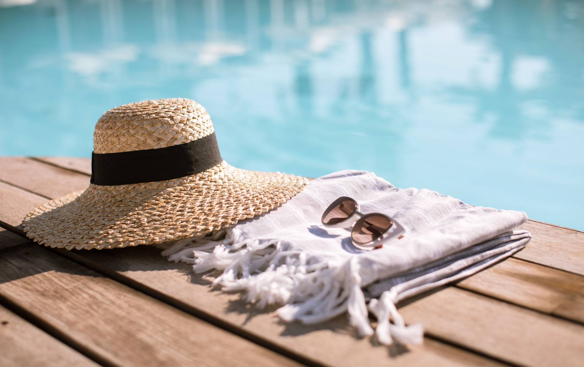 Sunglasses and straw hat