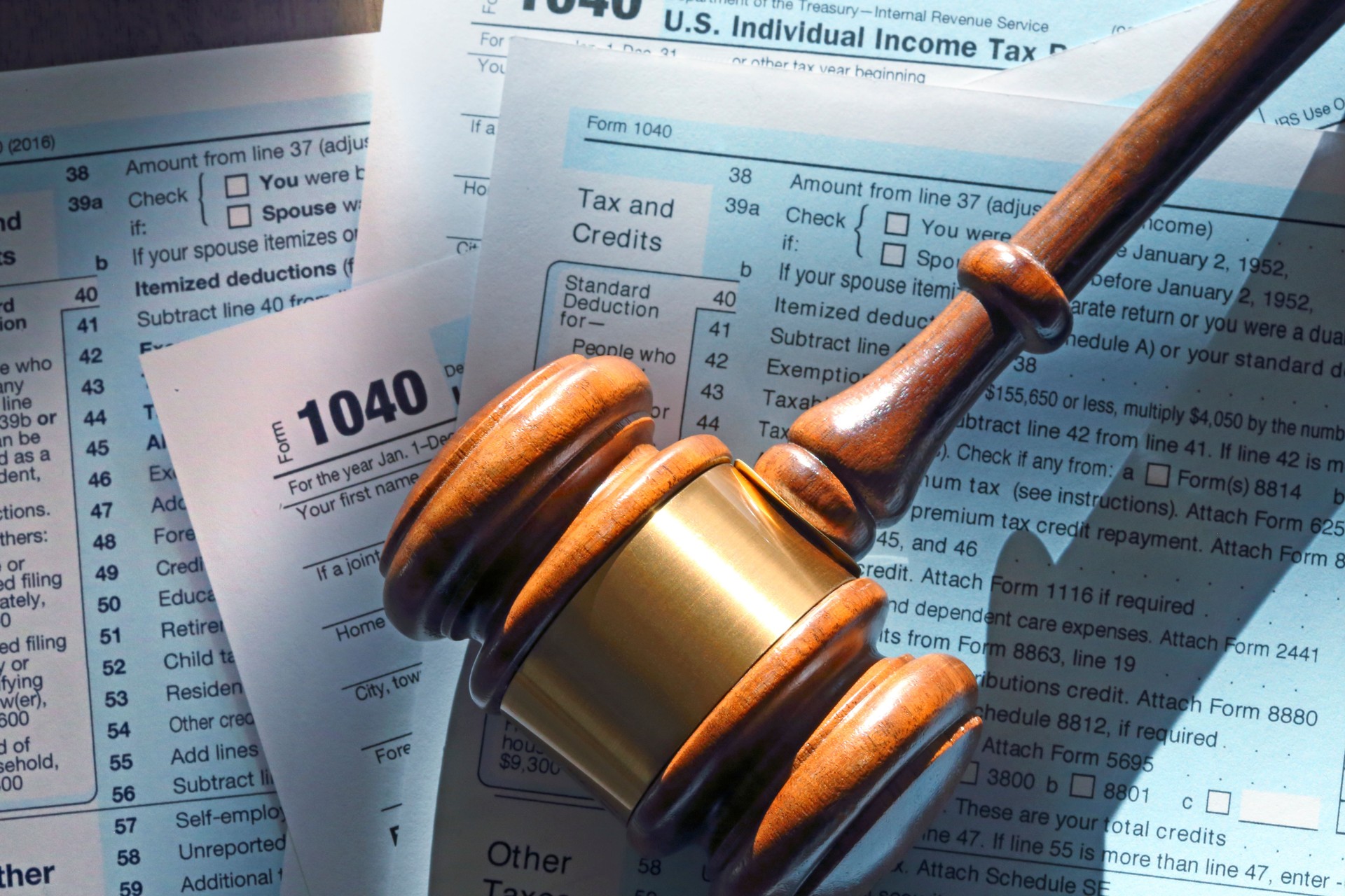 Gavel Resting On Top Of 1040 Tax Form