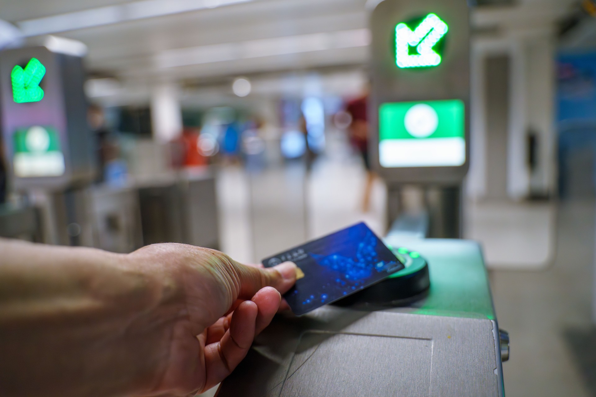 A female tourist entering the subway turnstile.Toronto TTC Metrolinx Presto machines . A contactless smart card is used to gain access to public transportation s
